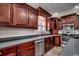 Traditional kitchen featuring dark wood cabinets, stainless steel appliances, and light countertops at 1585 Brookgreen Dr., Myrtle Beach, SC 29577