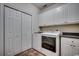 Bright laundry room with white cabinets, washer and dryer, and folding door at 1585 Brookgreen Dr., Myrtle Beach, SC 29577