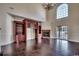 Bright living room with hardwood floors, fireplace, built-in shelving, and sliding glass doors at 1585 Brookgreen Dr., Myrtle Beach, SC 29577