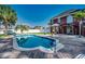 Inviting backyard featuring a private pool, brick patio, lush landscaping, and mature trees at 1585 Brookgreen Dr., Myrtle Beach, SC 29577