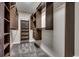 Walk-in closet with custom wood shelving and drawers for organized storage at 1585 Brookgreen Dr., Myrtle Beach, SC 29577