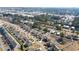 A neighborhood aerial view shows a community with neatly lined streets, landscaped yards, and manicured lawns at 160 Ocean Commons Dr., Surfside Beach, SC 29575