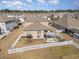 Aerial view of a home and fenced backyard, with a patio area, covered pergola, hot tub, and outdoor seating at 160 Ocean Commons Dr., Surfside Beach, SC 29575