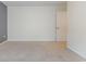 Unfurnished bedroom with neutral walls, plush carpeting, and white door at 160 Ocean Commons Dr., Surfside Beach, SC 29575