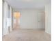 Unfurnished bedroom showcasing a window, neutral walls, and plush carpeting at 160 Ocean Commons Dr., Surfside Beach, SC 29575