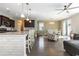 Open-concept kitchen and dining area featuring a large island with granite countertops at 160 Ocean Commons Dr., Surfside Beach, SC 29575