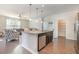 Kitchen island featuring granite countertops, stainless steel appliances, and hardwood floors at 160 Ocean Commons Dr., Surfside Beach, SC 29575