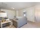 Cozy upper level living area with plush gray sofa and white accent table with modern lamp at 160 Ocean Commons Dr., Surfside Beach, SC 29575