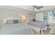 Cozy bedroom with two double beds, ceiling fan, and ample natural light, creating a relaxing retreat at 1625 S Ocean Blvd. # 1810, North Myrtle Beach, SC 29582