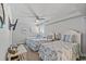 Serene bedroom with three beds, ceiling fan, and coastal-themed decor at 1625 S Ocean Blvd. # 1810, North Myrtle Beach, SC 29582