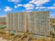 Impressive view of large multi-story condo buildings with swimming pools at 1625 S Ocean Blvd. # 1810, North Myrtle Beach, SC 29582