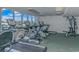 Bright gym with several treadmills and workout machines with an exterior view from large windows at 1625 S Ocean Blvd. # 1810, North Myrtle Beach, SC 29582