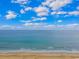 Picturesque view of the ocean from the beach, with a blue sky overhead and calming waves at 1625 S Ocean Blvd. # 1810, North Myrtle Beach, SC 29582