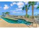 The community features a uniquely shaped pool, complete with sun loungers and palm trees at 1625 S Ocean Blvd. # 1810, North Myrtle Beach, SC 29582