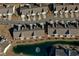 Aerial view of townhouse community with a pond and mature landscaping at 179-A Parmelee Dr. # A, Murrells Inlet, SC 29576