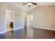 Bedroom featuring hardwood floors with views to the stairwell, hall, and closet at 179-A Parmelee Dr. # A, Murrells Inlet, SC 29576