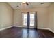 Bedroom featuring hardwood floors and glass doors to the backyard at 179-A Parmelee Dr. # A, Murrells Inlet, SC 29576