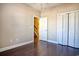 Bedroom with hardwood floors, neutral walls, and a closet at 179-A Parmelee Dr. # A, Murrells Inlet, SC 29576