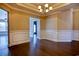 A dining room with wainscoting and views into other rooms at 179-A Parmelee Dr. # A, Murrells Inlet, SC 29576