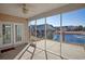 View from the screened porch overlooking a pond and backyard with nearby houses at 179-A Parmelee Dr. # A, Murrells Inlet, SC 29576