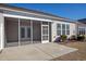 An inviting screened porch and a patio, perfect for outdoor relaxation and entertaining at 179-A Parmelee Dr. # A, Murrells Inlet, SC 29576