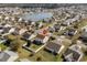 Aerial view of a neighborhood featuring a lake and highlighting the location of a home with a red pin at 182 Tibton Circle, Myrtle Beach, SC 29588