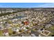 Aerial view of a neighborhood featuring a lake and highlighting the location of a home with a red pin at 182 Tibton Circle, Myrtle Beach, SC 29588