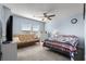 Cozy bedroom with a bed, ceiling fan, and a window, creating a comfortable space for rest and relaxation at 182 Tibton Circle, Myrtle Beach, SC 29588