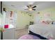 Charming bedroom featuring a bed, dresser, and whimsical wall decorations, ideal for children at 182 Tibton Circle, Myrtle Beach, SC 29588