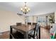 Dining area with a dark wood table and chairs, plus a small table to the side at 182 Tibton Circle, Myrtle Beach, SC 29588