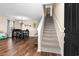 Bright entryway featuring wood floors, a staircase, and access to the dining area at 182 Tibton Circle, Myrtle Beach, SC 29588