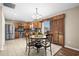 Well-lit kitchen featuring stainless steel appliances, wood cabinets, and a cozy breakfast nook at 182 Tibton Circle, Myrtle Beach, SC 29588