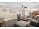 Comfortable living room featuring a large sectional sofa, ceiling fan, and stylish decor at 182 Tibton Circle, Myrtle Beach, SC 29588