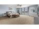 Bright main bedroom with large windows, a ceiling fan, and neutral tones for a peaceful retreat at 182 Tibton Circle, Myrtle Beach, SC 29588