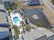 Aerial shot of a community featuring a pool and serene pond at 1891 Colony Dr. # 15-G, Surfside Beach, SC 29575