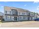 Charming two-story townhome with neutral paint, dark shutters, and well-manicured landscaping at 1891 Colony Dr. # 15-G, Surfside Beach, SC 29575