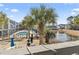 View of the inviting pool area, palm trees and a serene pond with fountain at 1891 Colony Dr. # 15-G, Surfside Beach, SC 29575