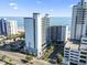 Stunning aerial view of beachfront high-rise condos with ocean views and convenient parking at 2001 S Ocean Blvd. # 209, Myrtle Beach, SC 29577