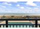 Balcony view offers a panorama of beach and pool, perfect for relaxation and ocean gazing at 2001 S Ocean Blvd. # 209, Myrtle Beach, SC 29577