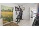 Small home exercise space with compact multi gym and artwork at 2001 S Ocean Blvd. # 209, Myrtle Beach, SC 29577