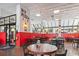 Interior of a NY Pizza Kitchen restaurant with tables and chairs at 2001 S Ocean Blvd. # 209, Myrtle Beach, SC 29577