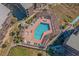 Aerial shot showcasing the swimming pool with surrounding lounge areas, greenery, and beautiful landscaping at 207 3Rd Ave. N # 348, North Myrtle Beach, SC 29582