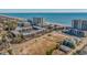 Wide aerial panorama featuring the real estate complex, with a blend of residential buildings and ocean views at 207 3Rd Ave. N # 348, North Myrtle Beach, SC 29582