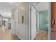 Hallway features a door, lighting, wainscotting, and luxury vinyl plank flooring at 207 3Rd Ave. N # 348, North Myrtle Beach, SC 29582