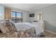 Comfortable bedroom featuring a large bed, white dresser, and a window offering a view of the surroundings at 207 3Rd Ave. N # 348, North Myrtle Beach, SC 29582