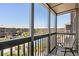 Secluded screened porch with a view of the tennis courts and resort buildings at 207 3Rd Ave. N # 348, North Myrtle Beach, SC 29582