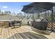 Back deck with outdoor furniture, umbrella, and grill at 2192 Bell Rd., Longs, SC 29568