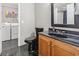 The bathroom features a vanity with tile flooring, washer, dryer, and a shower with glass doors at 2192 Bell Rd., Longs, SC 29568