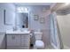 Bathroom featuring a toilet and vanity with updated mirror and finishes plus a shower and curtain at 223 Maisons Dr. # A8, Myrtle Beach, SC 29572