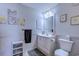 Bathroom featuring white vanity, framed mirror, decorative accents and coordinated wall art at 223 Maisons Dr. # A8, Myrtle Beach, SC 29572